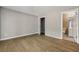 Neutral bedroom with hardwood floors and an ensuite bathroom at 3571 Oakshire Se Way, Atlanta, GA 30354