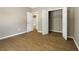 This is a view of the bedroom with hardwood floors, closet and a glimpse into the bathroom at 3571 Oakshire Se Way, Atlanta, GA 30354