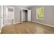 This is a bedroom with hardwood floors, a closet, a window, and a door to the bathroom at 3571 Oakshire Se Way, Atlanta, GA 30354