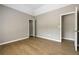 This is a view of the bedroom with hardwood floors and a closet, with door open at 3571 Oakshire Se Way, Atlanta, GA 30354