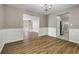 Dining room with wood floors, wainscoting and view into adjacent room at 3571 Oakshire Se Way, Atlanta, GA 30354