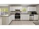 Updated kitchen with stainless steel appliances, ample counter space and natural lighting at 3571 Oakshire Se Way, Atlanta, GA 30354