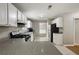 Updated kitchen boasts modern appliances, granite countertops, and tile flooring at 3571 Oakshire Se Way, Atlanta, GA 30354