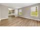 Bright living room with wood floors, neutral walls, and large windows overlooking the lawn at 3571 Oakshire Se Way, Atlanta, GA 30354