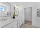 Bright bathroom features dual sinks, a walk-in closet and modern lighting at 392 Pratt Dr # 2013, Atlanta, GA 30315