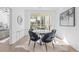 Bright dining area features a round table, plush chairs and sliding glass door to the outdoor patio at 392 Pratt Dr # 2013, Atlanta, GA 30315