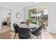 Bright dining area features a round table, plush chairs and sliding glass door to the outdoor patio at 392 Pratt Dr # 2013, Atlanta, GA 30315