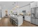 Bright kitchen featuring stainless steel appliances, a large island with seating, and modern lighting at 392 Pratt Dr # 2013, Atlanta, GA 30315