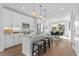 Modern kitchen with white cabinets, stainless steel appliances, an island, and stylish pendant lighting at 392 Pratt Dr # 2013, Atlanta, GA 30315