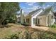 Large backyard with a patio and white siding with lots of windows at 4805 Diggers Way, Sugar Hill, GA 30518