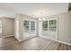 Dining room with wood floors, natural lighting and windows with backyard views at 4805 Diggers Way, Sugar Hill, GA 30518