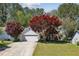 Charming single-Gathering home with a well-maintained lawn, mature trees, and inviting curb appeal at 4805 Diggers Way, Sugar Hill, GA 30518