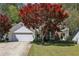 Charming single-Gathering home with a well-maintained lawn, mature trees, and inviting curb appeal at 4805 Diggers Way, Sugar Hill, GA 30518
