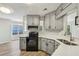 This bright kitchen offers an open view into the dining area with plentiful natural light at 4805 Diggers Way, Sugar Hill, GA 30518