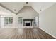 Spacious living room with vaulted ceilings, modern fireplace, and large windows offering abundant natural light at 4805 Diggers Way, Sugar Hill, GA 30518
