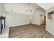 Spacious living room featuring wood floors, a fireplace, and vaulted ceilings at 4805 Diggers Way, Sugar Hill, GA 30518