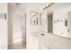 Clean bathroom featuring a large mirror, white vanity, and a shower/tub combo at 772 Bostonian Way, Lawrenceville, GA 30046