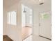 Bright foyer featuring neutral walls, a glass paneled front door, and views of a dining room at 772 Bostonian Way, Lawrenceville, GA 30046