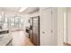Spacious kitchen with stainless steel appliances and wood flooring at 772 Bostonian Way, Lawrenceville, GA 30046