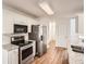 Well-equipped kitchen with stainless steel appliances and granite countertops at 772 Bostonian Way, Lawrenceville, GA 30046