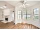 Cozy living room featuring a fireplace and large windows at 772 Bostonian Way, Lawrenceville, GA 30046