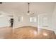 Spacious living room featuring hardwood floors and an open view of the kitchen and entryway at 772 Bostonian Way, Lawrenceville, GA 30046