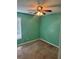 Cozy bedroom featuring carpeted floors, a ceiling fan, and a window allowing for natural light to enter at 10111 Commons Way, Jonesboro, GA 30238
