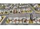 Aerial view showcasing neighborhood townhomes, manicured lawns and streets from above at 1329 Bennett Creek Ovlk, Suwanee, GA 30024