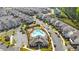 Aerial view of community pool and clubhouse surrounded by beautifully designed homes and lush landscaping at 1329 Bennett Creek Ovlk, Suwanee, GA 30024