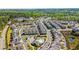 Expansive aerial view of a vibrant residential neighborhood with diverse housing and lush greenery at 1329 Bennett Creek Ovlk, Suwanee, GA 30024