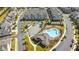 Aerial view showcases a community pool and clubhouse, accented by well-maintained lawns and convenient parking at 1329 Bennett Creek Ovlk, Suwanee, GA 30024