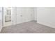 Carpeted bedroom showing a view to the ensuite bathroom and closet at 1329 Bennett Creek Ovlk, Suwanee, GA 30024