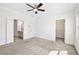 Open carpeted bedroom leading to the ensuite bathroom and walk-in closet at 1329 Bennett Creek Ovlk, Suwanee, GA 30024