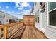 A spacious wooden deck with a wood railing and a privacy screen at 1329 Bennett Creek Ovlk, Suwanee, GA 30024