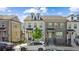 Charming townhomes with brick and siding exteriors, dormer windows, and manicured front yards create a welcoming curb appeal at 1329 Bennett Creek Ovlk, Suwanee, GA 30024