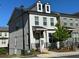 Charming two-story townhome with painted brick, dormer windows and manicured landscaping at 1329 Bennett Creek Ovlk, Suwanee, GA 30024