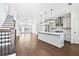 Open-concept kitchen with stainless steel appliances, island and hardwood floors at 1329 Bennett Creek Ovlk, Suwanee, GA 30024