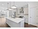 Bright kitchen featuring a large island, stainless steel appliances, and pendant lighting at 1329 Bennett Creek Ovlk, Suwanee, GA 30024