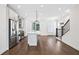 Open-concept kitchen with a spacious island, stainless steel appliances, and hardwood floors at 1329 Bennett Creek Ovlk, Suwanee, GA 30024