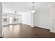 Bright living room with hardwood floors, large windows and a glass panel door at 1329 Bennett Creek Ovlk, Suwanee, GA 30024