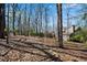 Spacious wooded lot with mature trees behind a brick home at 1548 Valley Reserve Nw Ct, Kennesaw, GA 30152