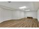 Spacious basement with laminate floors, ceiling fan, and ample room for customization at 1548 Valley Reserve Nw Ct, Kennesaw, GA 30152