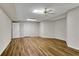 Spacious basement with laminate floors, ceiling fan, and ample room for customization at 1548 Valley Reserve Nw Ct, Kennesaw, GA 30152