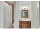 Cozy bathroom featuring shower with white curtain and a vanity with dark wood cabinets at 1548 Valley Reserve Nw Ct, Kennesaw, GA 30152