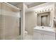 Contemporary bathroom featuring glass enclosed shower, vanity, and ample lighting at 1548 Valley Reserve Nw Ct, Kennesaw, GA 30152