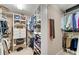 Organized walk-in closet with custom shelving and storage options for optimal organization at 1548 Valley Reserve Nw Ct, Kennesaw, GA 30152