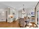 Charming dining area with hardwood floors and a decorative chandelier and natural light at 1548 Valley Reserve Nw Ct, Kennesaw, GA 30152
