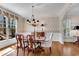 Formal dining room with classic decor, hardwood floors, and large windows at 1548 Valley Reserve Nw Ct, Kennesaw, GA 30152