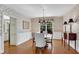 Elegant dining room featuring wallpaper, hardwood floors, and traditional furniture at 1548 Valley Reserve Nw Ct, Kennesaw, GA 30152