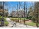 Inviting home with mature trees, manicured lawn, and a stone exterior, offering great curb appeal at 1548 Valley Reserve Nw Ct, Kennesaw, GA 30152